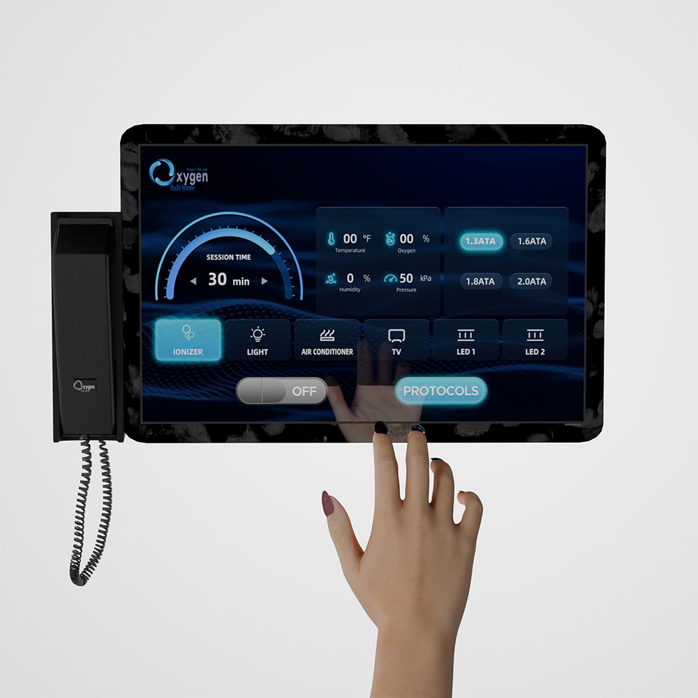 Close-up of the Oxygen internal touchscreen control panel with intercom handset showing session time, temperature, oxygen, humidity and pressure readouts, ATA pressure selectors, and function buttons